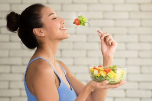 woman eating well to manage eczema symptoms